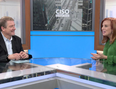 Theresa Payton and Bret Arsenault seated at a counter in a professional studio setting with CISO Spotlight Series and CISO city image in background.
