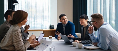 A group of people sitting around a table.