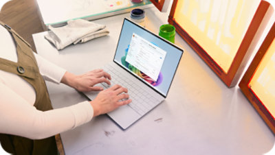 Person working on a laptop with a business application open.