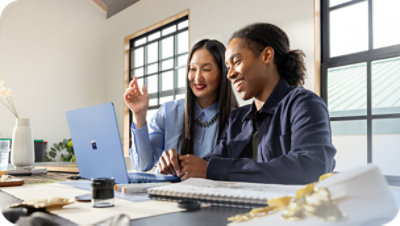 Two people collaborating with a tablet in an office.