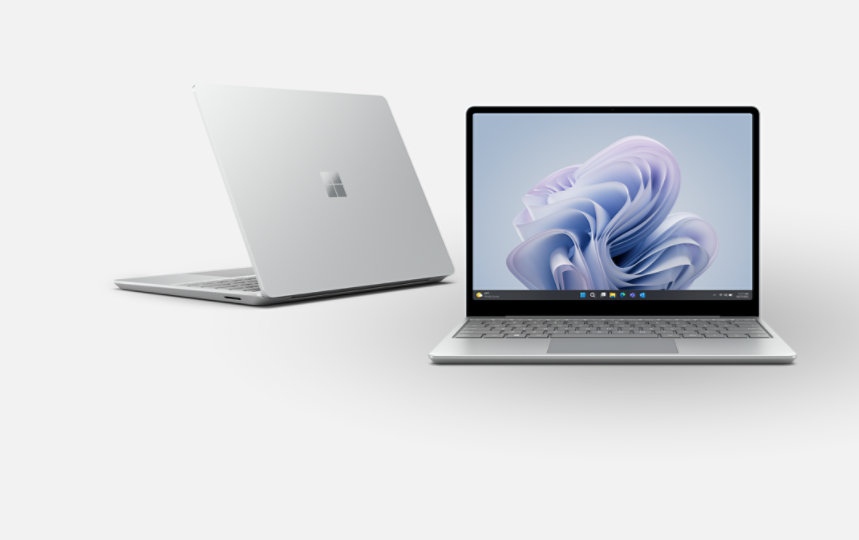 A back view of a Surface  Laptop Go 3 for Business and a front view of a Surface Laptop Go 3 for Business. 