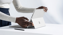 A person using a Surface Pro 8, with type cover and Slim Pen.