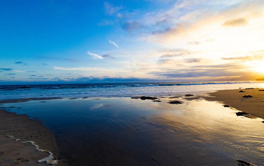 View of the ocean shore at sunrise