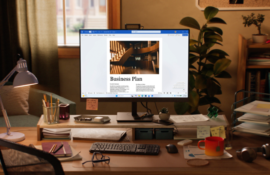 A tablet shows Excel in a home office.