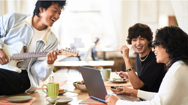 A group of students collaborating on a school project using Office 365 for students.