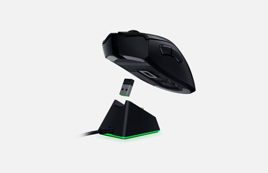 Razer wireless mouse above back-lit USB charging station to show how it connects.
