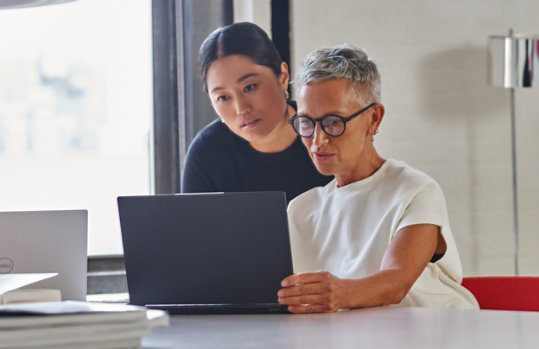 Two women in an office. 