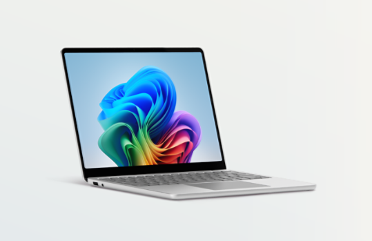 An angled view shows a Surface Laptop, Copilot+ PC, 13-inch in the colour Platinum.