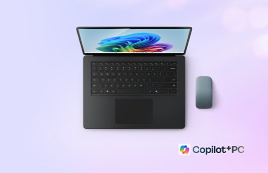 A black Surface Laptop with an Arc Mouse in the colour ocean.