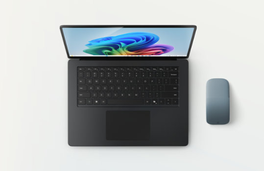 A black, 15-inch Surface Laptop with an Ocean Surface Arc Mouse.