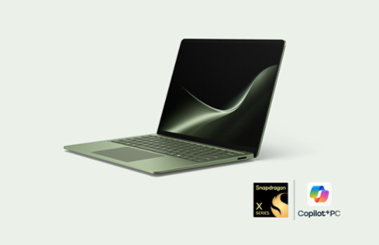 An angled 13.8-inch Surface Laptop in the color Jade.