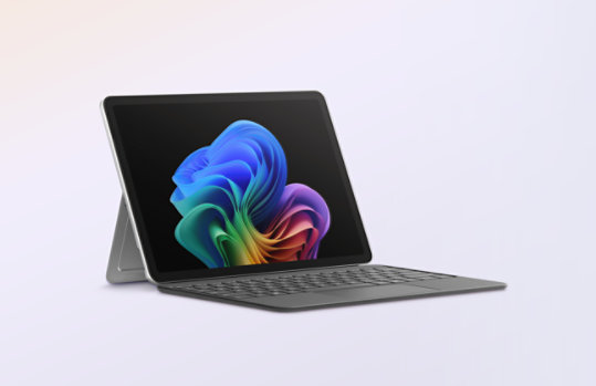 A Surface Pro for Business, Copilot+ PC, 12-inch | Snapdragon attached to a Surface Pro 12-inch Keyboard for Business.