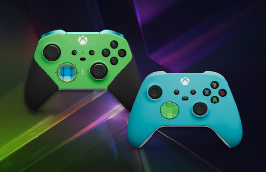 A green XBOX controller and a teal Xbox controller from the XBox Design Lab.