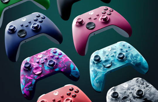 Left angled view of various colors of wireless Xbox controllers.