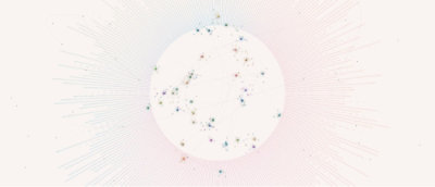 A white circle with blue and green specks.