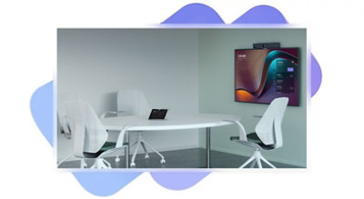 A room with a table and chairs and a tv on the wall.