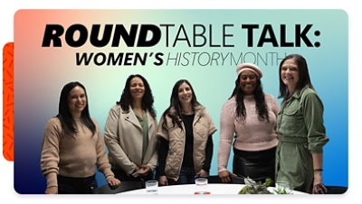 Image of five women of different backgrounds standing at a table, with the words &ldquo;Roundtable talk: Women&rsquo;s History Month&rdquo; on the image