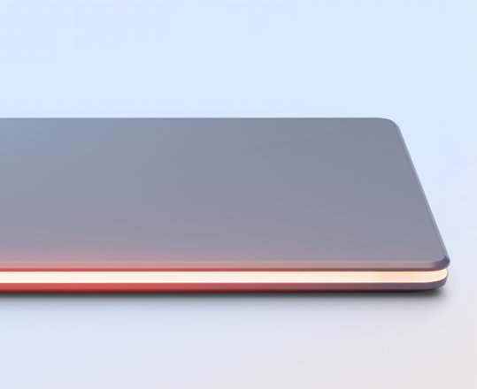 Closed laptop with glowing light red light around edges