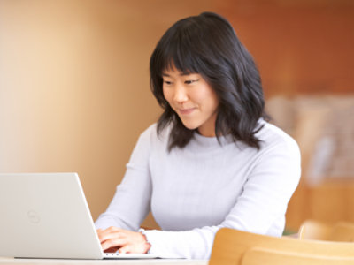 A woman looking at a computer screen