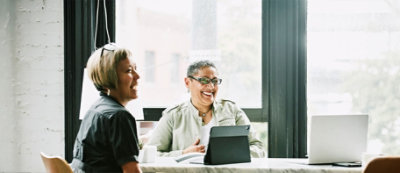 A person smiling at another person