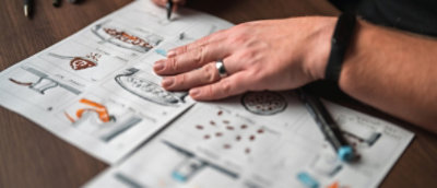A person drawing a storyboard for a creative project during pre-production.