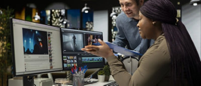 A creative team of editors collaborating on a movie montage project.
