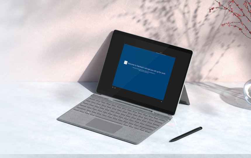 Surface device with type cover and pen on a desktop