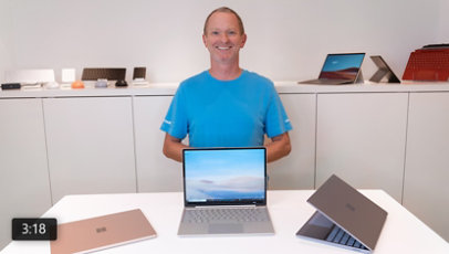 A person displays a variety of Surface devices.