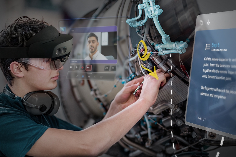 Persona skatās praktisko padomu video, izmantojot HoloLens 2, vienlaikus remontējot iekārtu.