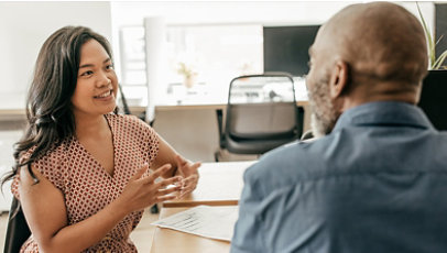 Two colleagues talking in an office