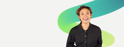 A girl in a black shirt, standing and laughing.