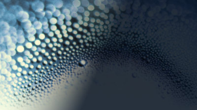 Water droplets and circles on a white and dark blue gradient background.