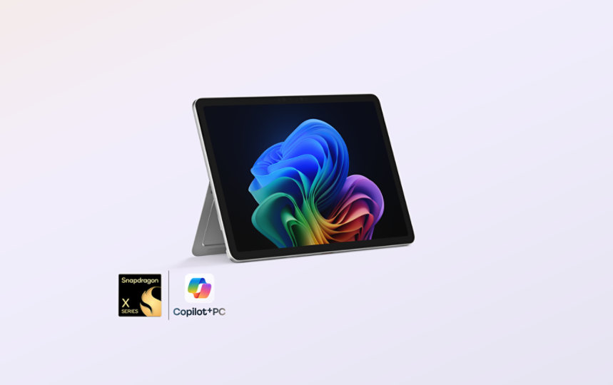 A Platinum 12-inch Surface Pro in kickstand mode with a badge lockup for snapdragon processors and CoPilot + PC.