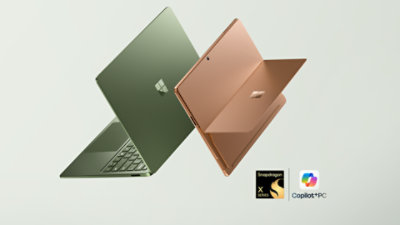 The latest edition Surface PCs—a floating Surface Laptop, 13.8-inch (8th Edition) in the color Jade and a floating Surface Pro, 13-inch (12th Edition) in the color Dune.