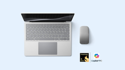 A 13.8-inch Surface Laptop and Surface Arc Mouse, both in the color Platinum.