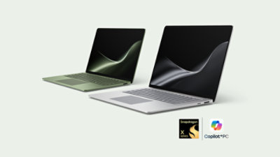 A 13-inch Surface Laptop in the colour Jade beside a 15-inch Surface Laptop in the colour Platinum.