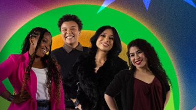 Four women of color smiling together, sharing their experiences in tech at Microsoft.