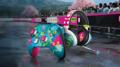 Xbox Wireless Controller and Xbox Headset in Forza Horizon 6 Limited Edition design, placed on a racing track with Mount Fuji in the background.