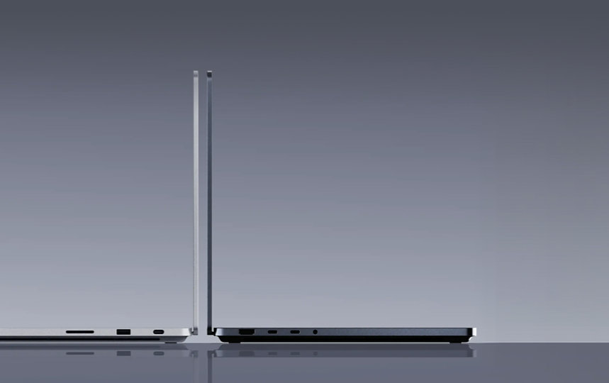 Two Surface Laptop Ultra for Business devices back-to-back, one in the color Nightfall, the other in the color Platinum.