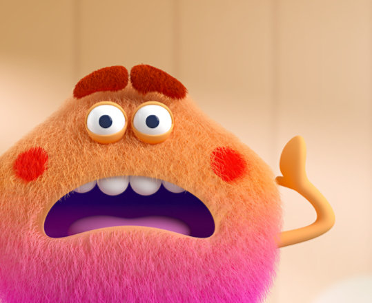 A very cute, fluffy, orange monster makes a frustrated face.