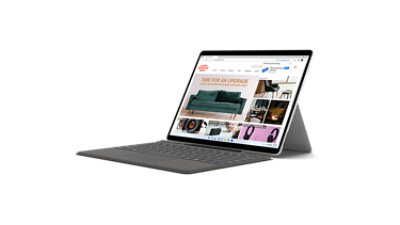Ein Surface Pro X und ein Surface Typecover im Laptop Modus