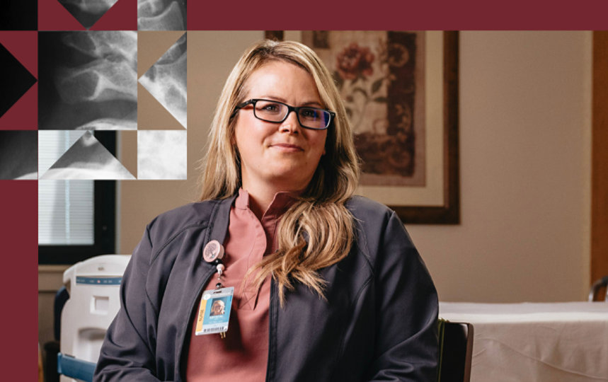 A Summit Healthcare nurse in pink scrubs in a hospital room.