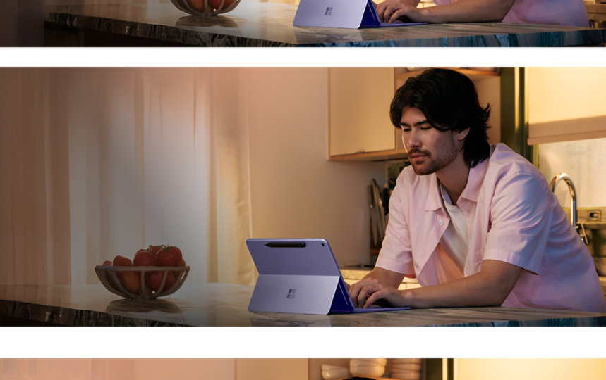 キッチンカウンターでSurface Proを使用する男性。