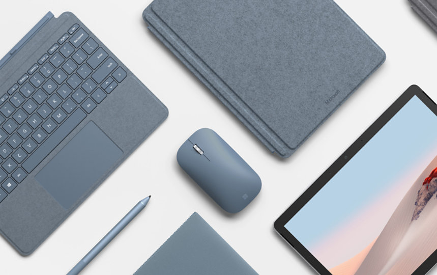 Surface Mobile Mouse surrounded by matching devices and accessories.