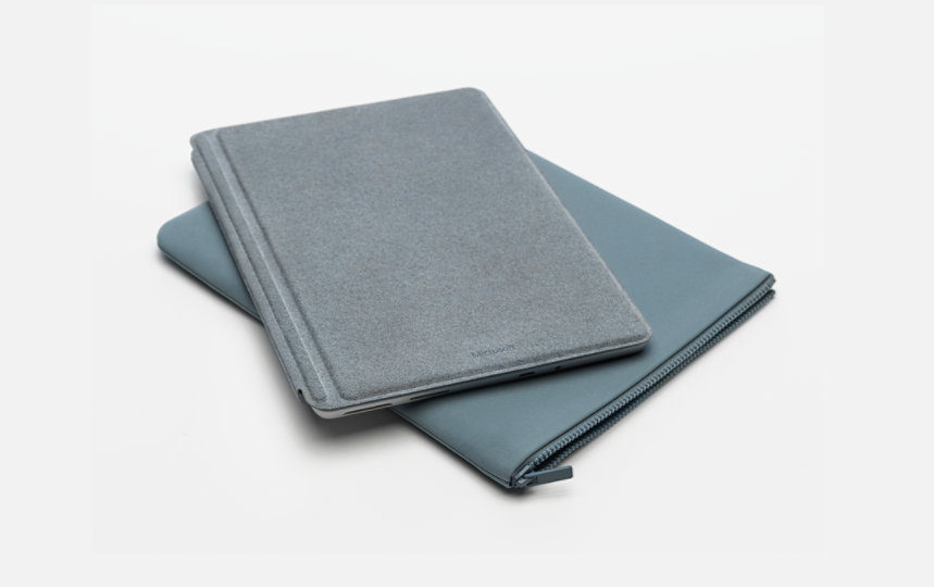 Surface Go with Surface Go Type Cover on top of a Surface Go Sleeve.