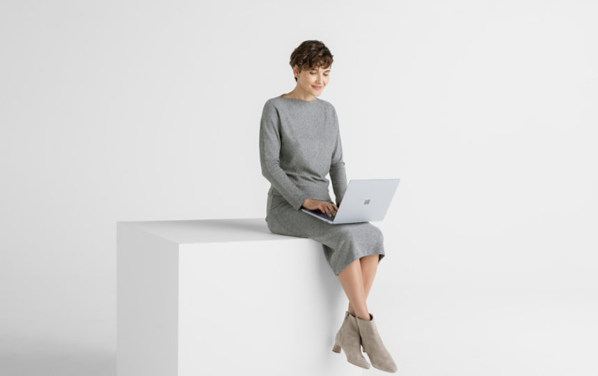 A person uses a Surface Laptop 6 for Business.
