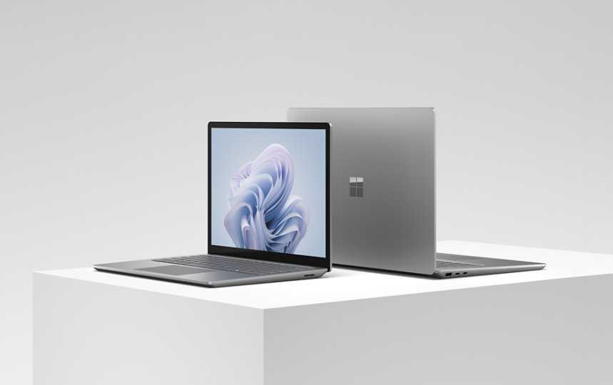 A 13.5-inch a Surface Laptop 6 for Business and a 15-inch Surface Laptop 6 for Business back-to-back.
