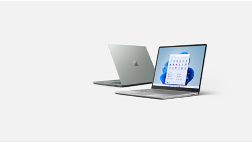 Two Surface Laptop Go 2 devices in the colours Platinum and Sage.