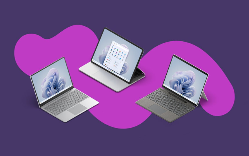 A Surface Laptop Studio, Laptop Go 2 and Pro 9 with attached Pro Signature Keyboard and Slim Pen 2.