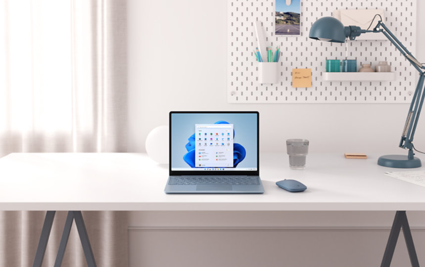 Ice Blue Surface Laptop Go on a desk.